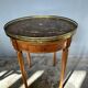 Hot water bottle table with a marble top and a brass gallery.