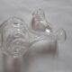 Cut crystal oil bottle with its crystal stopper.