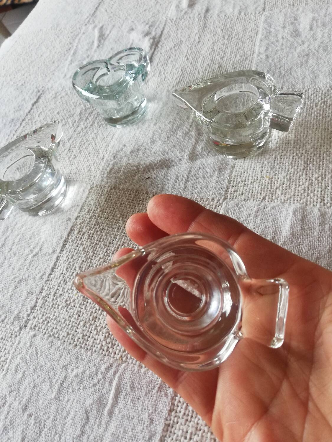 Set of four small transparent glass candle holders 3 spikes 1 heart