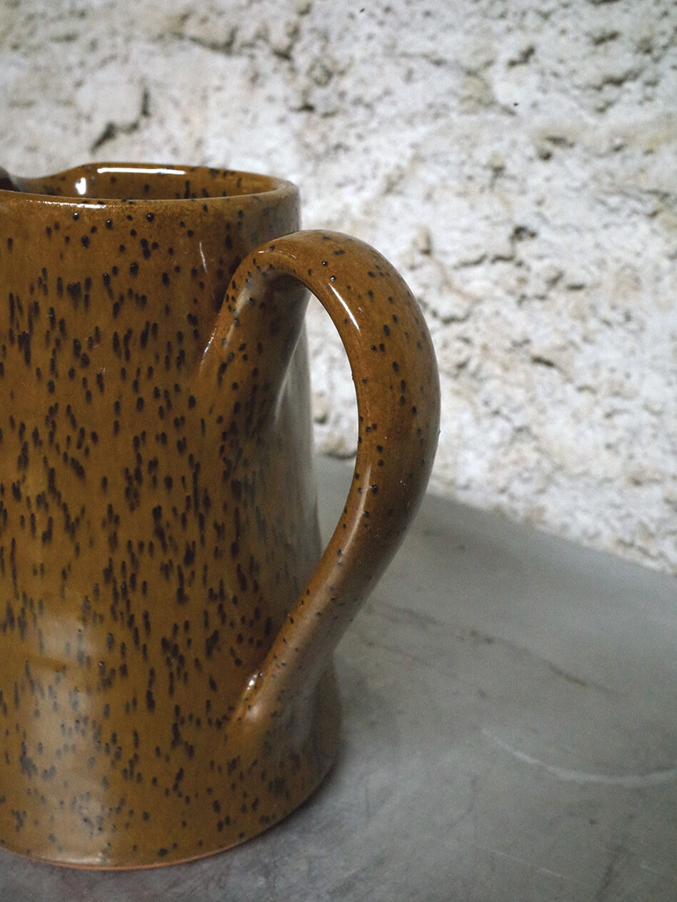 Milk pitcher in spotted sandstone