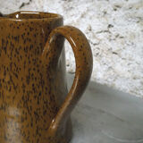 Milk pitcher in spotted sandstone