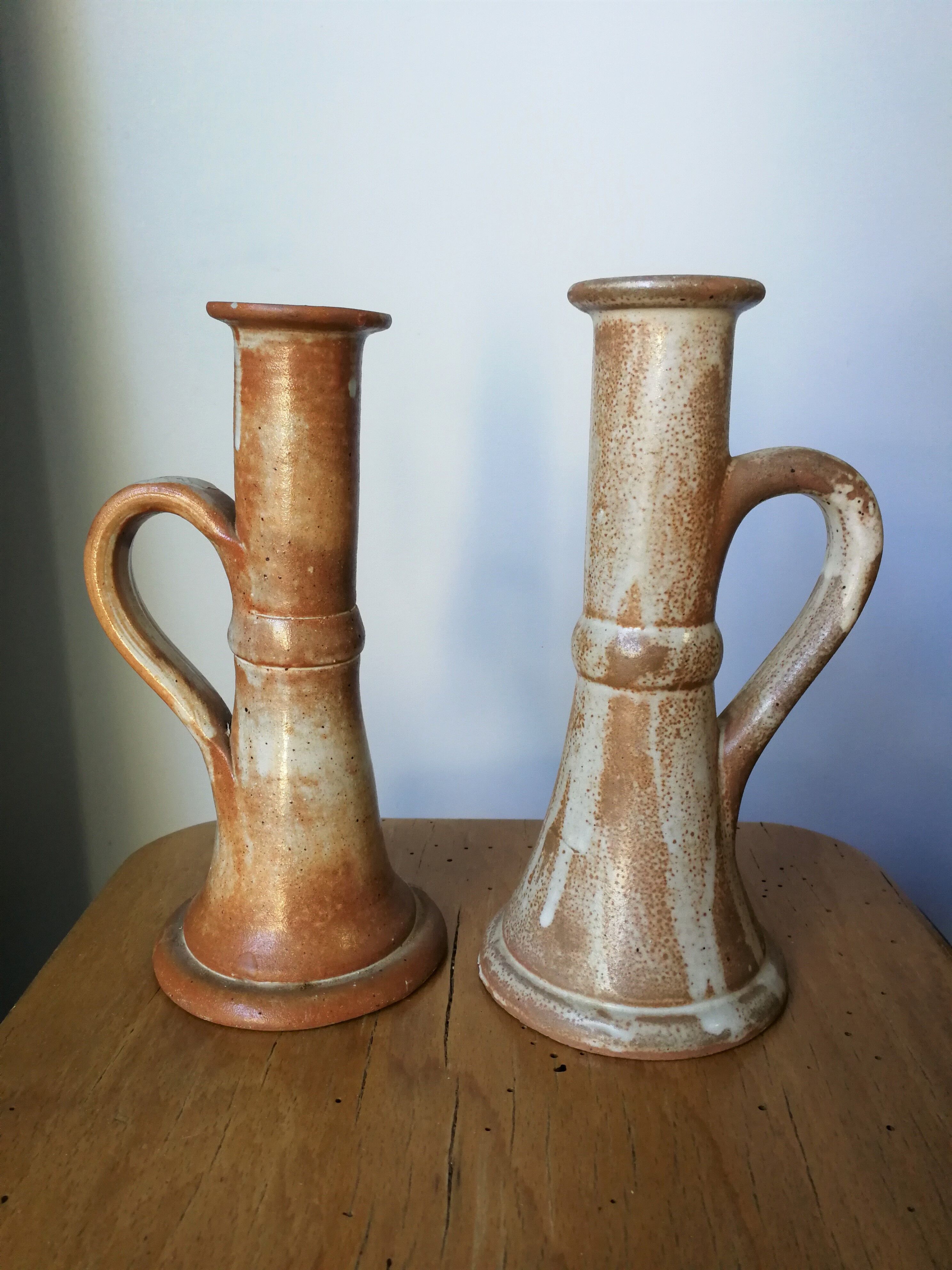 Pair of glazed stoneware candle holders