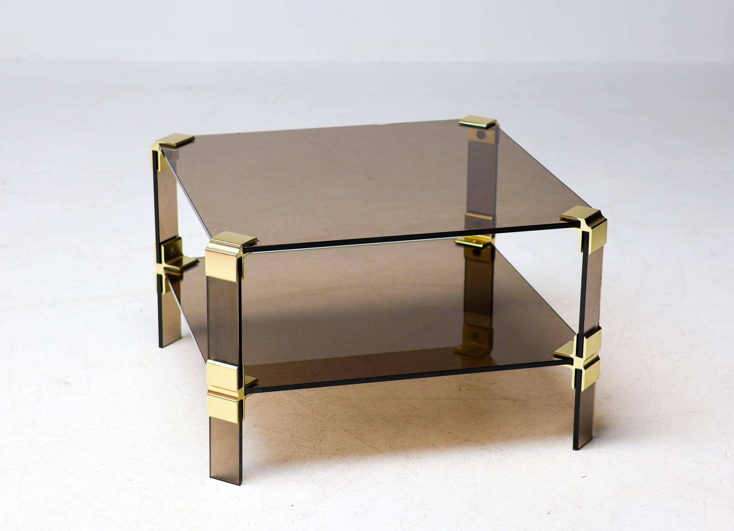 Hollywood Regency coffee table in brass and smoked glass, chic two-tier coffee table.