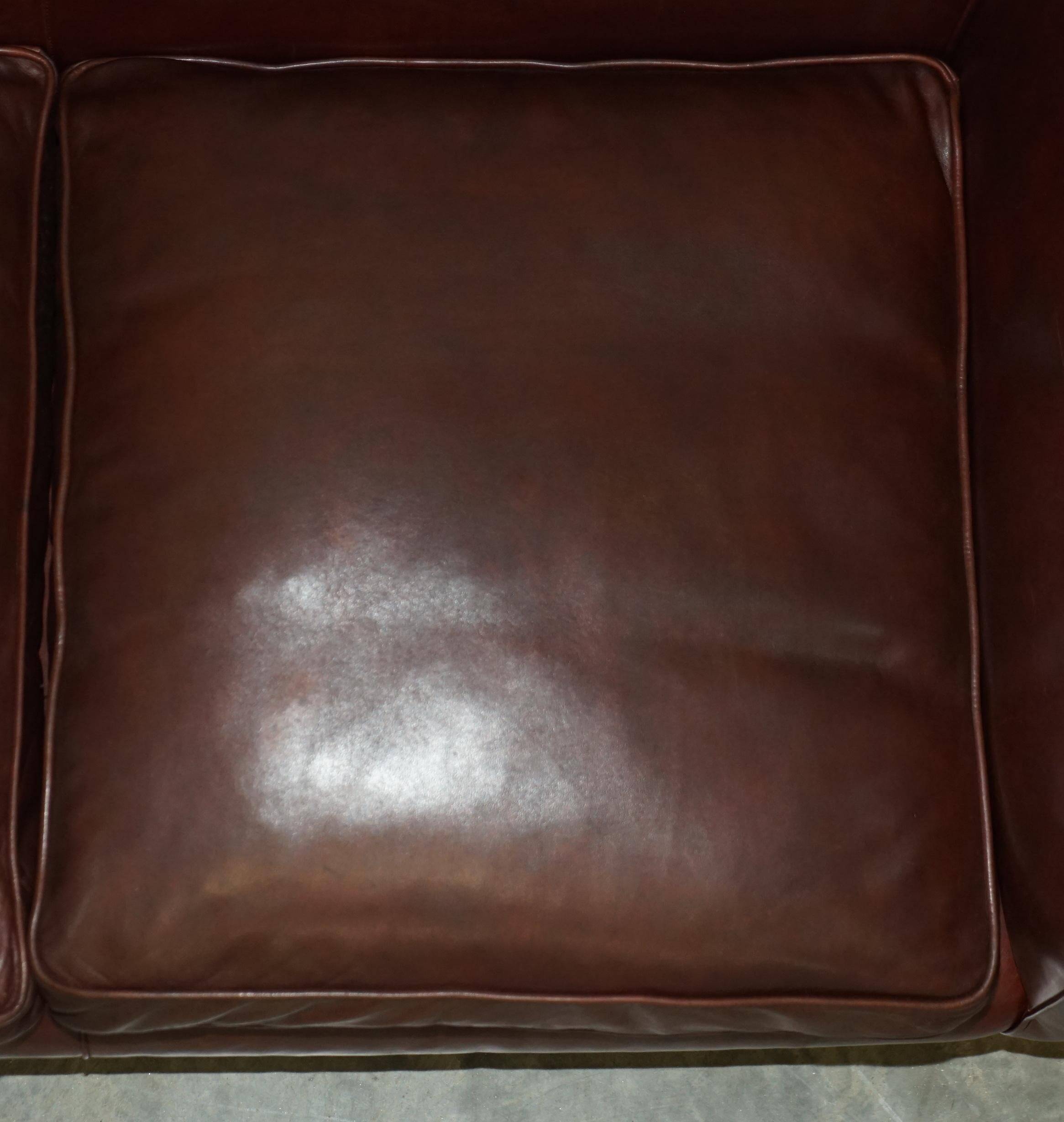 Vintage Art Deco leather sofa, three-seater, feather cushions.