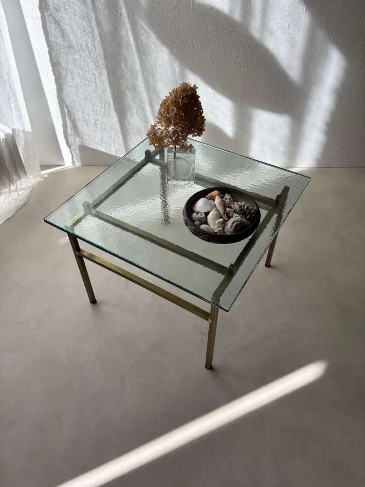Swedish brass coffee table with a marbled glass top from the 1960s.