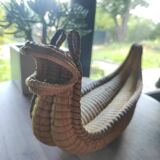 Original and vintage woven basket in the shape of an Asian dragon
