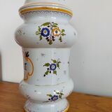 Vintage antique pharmacy jar in earthenware floral patterns