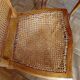 Carved wooden dining table and its 5 rattan caned chairs.