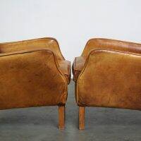 Set of English style light cognac colored leather armchairs.