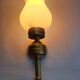 Three Empire style golden torch wall sconces