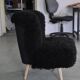 Mid-century black cocktail chair in lambskin, beech legs — 1960s