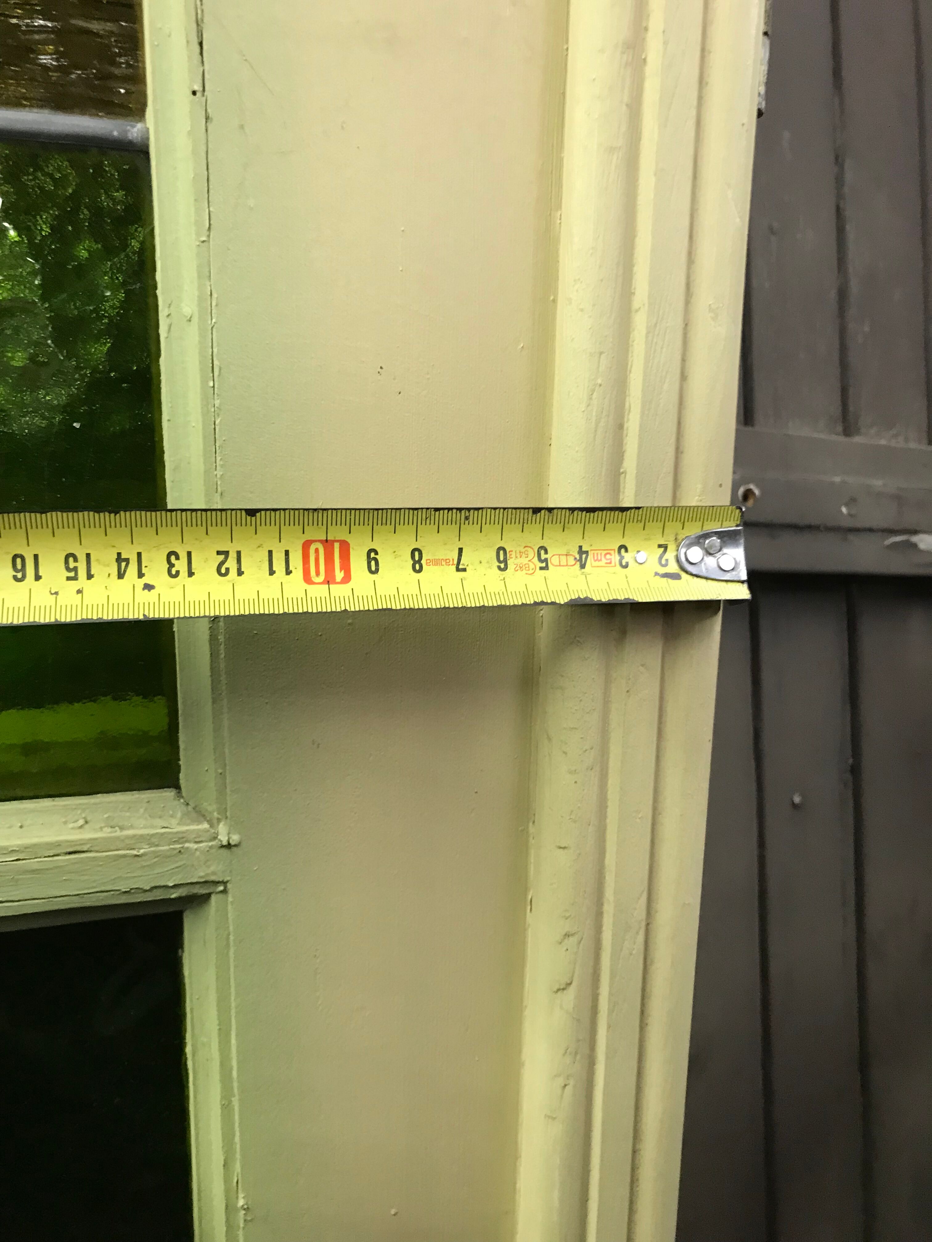 Series of three doors with stained glass windows