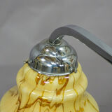 Antique Art Deco chandelier with three glass lampshades.