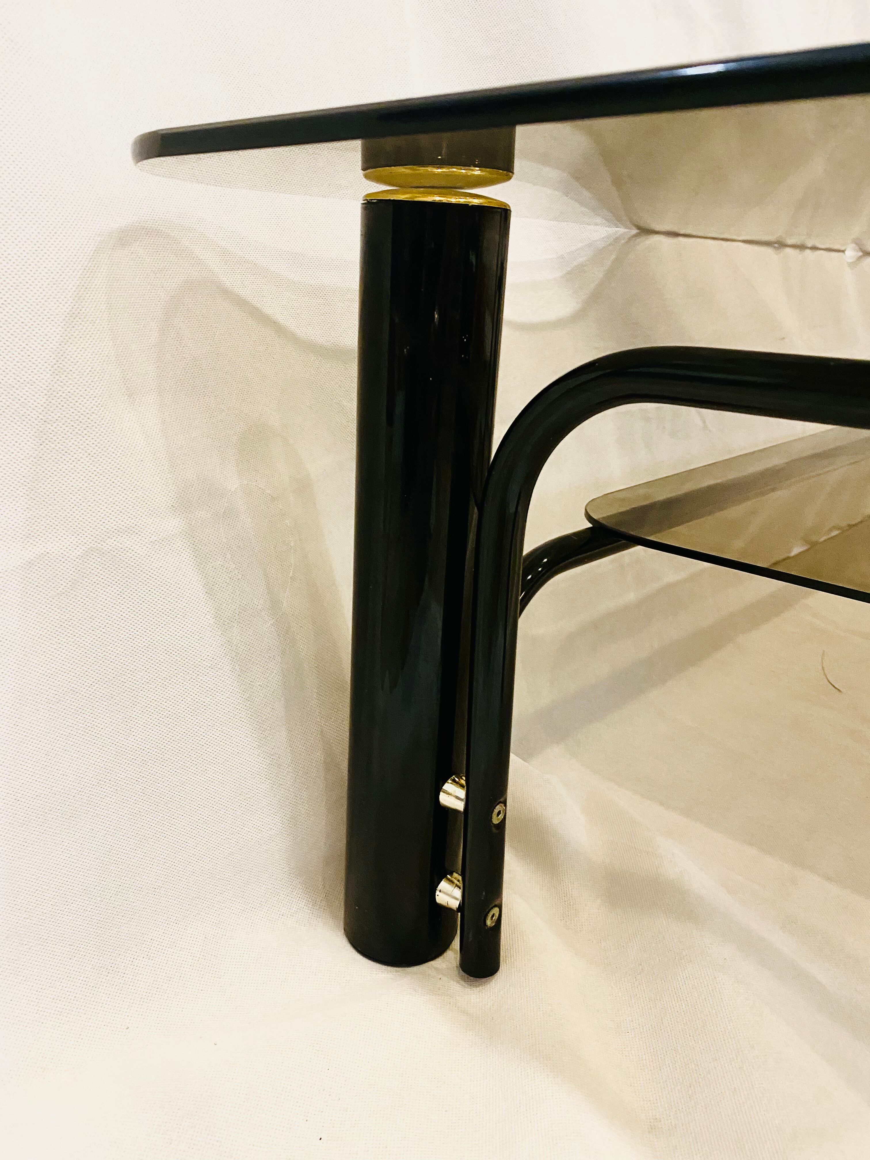 Black and gold coffee table with double tops in smoked glass circa 1970
