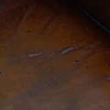 Sheepskin Wingback Chair with Warm Tones and Black Piping