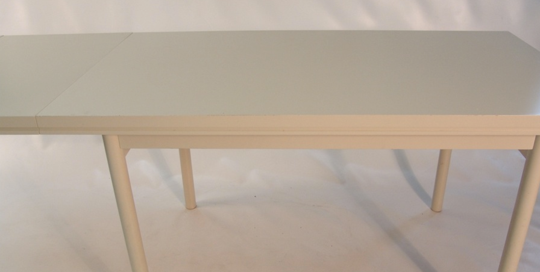 Beige extendable wooden table