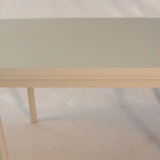 Beige extendable wooden table