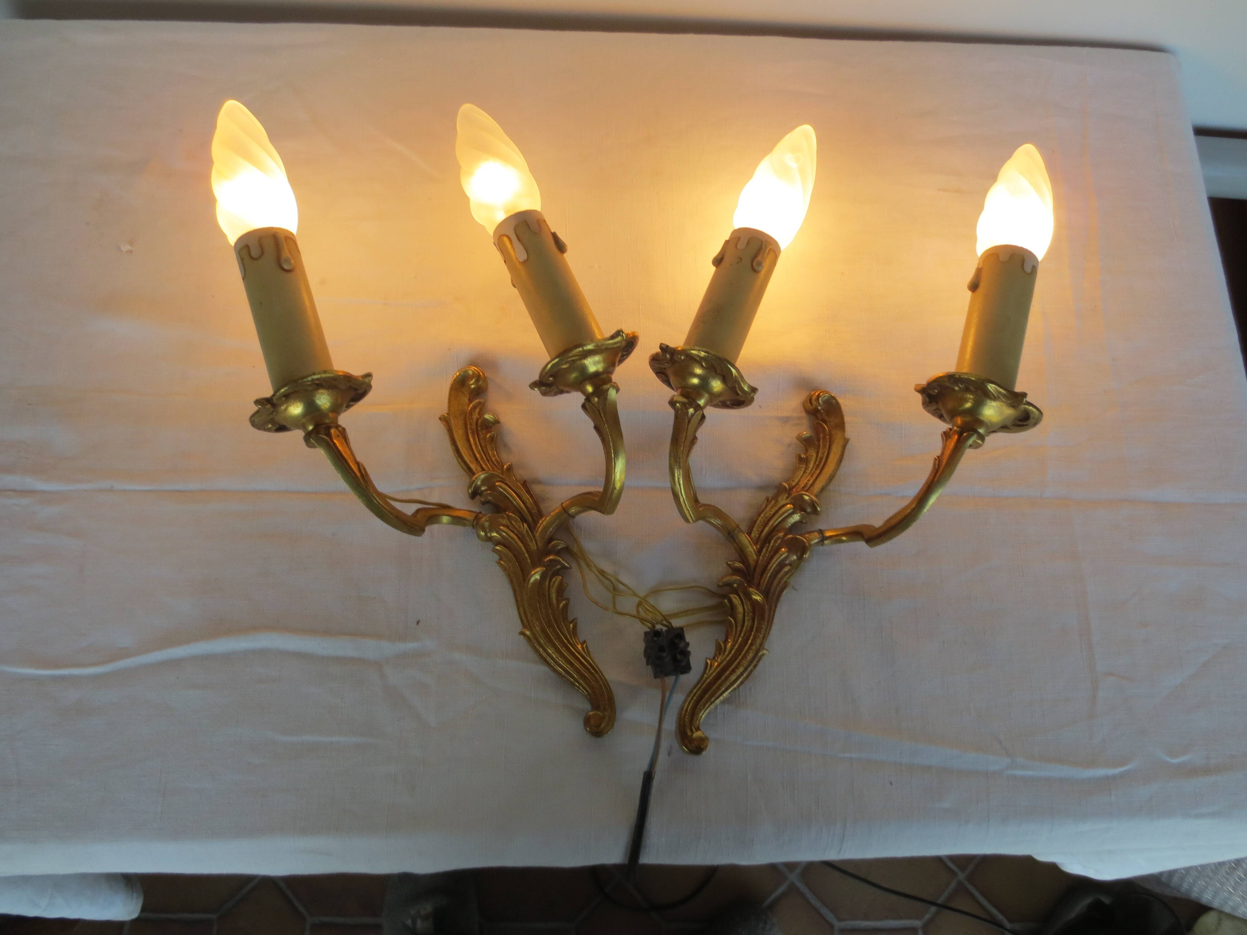 Pair of double wall lights in gilded bronze
