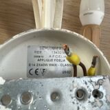 Vintage wrought iron wall sconce in the shape of a flower/leaf