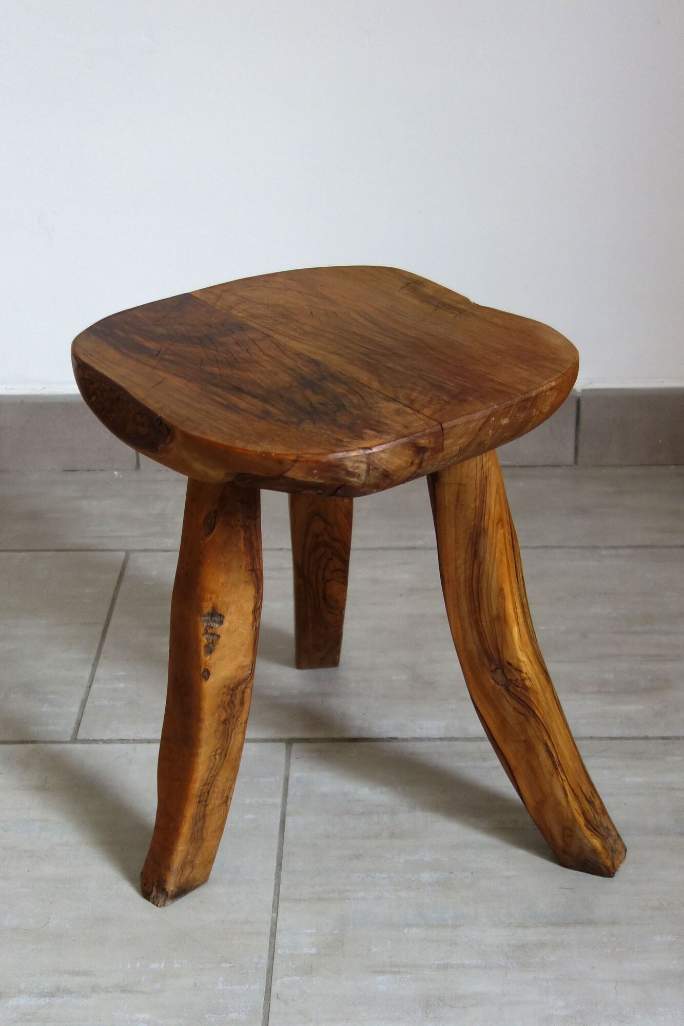 Brutalist stool made of olive wood