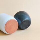 Duo of small black and white ceramic vases