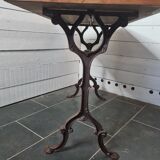 Bistro table with cast iron base and oak top