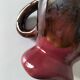 Vintage pitcher in raspberry red and chocolate flamed ceramic.