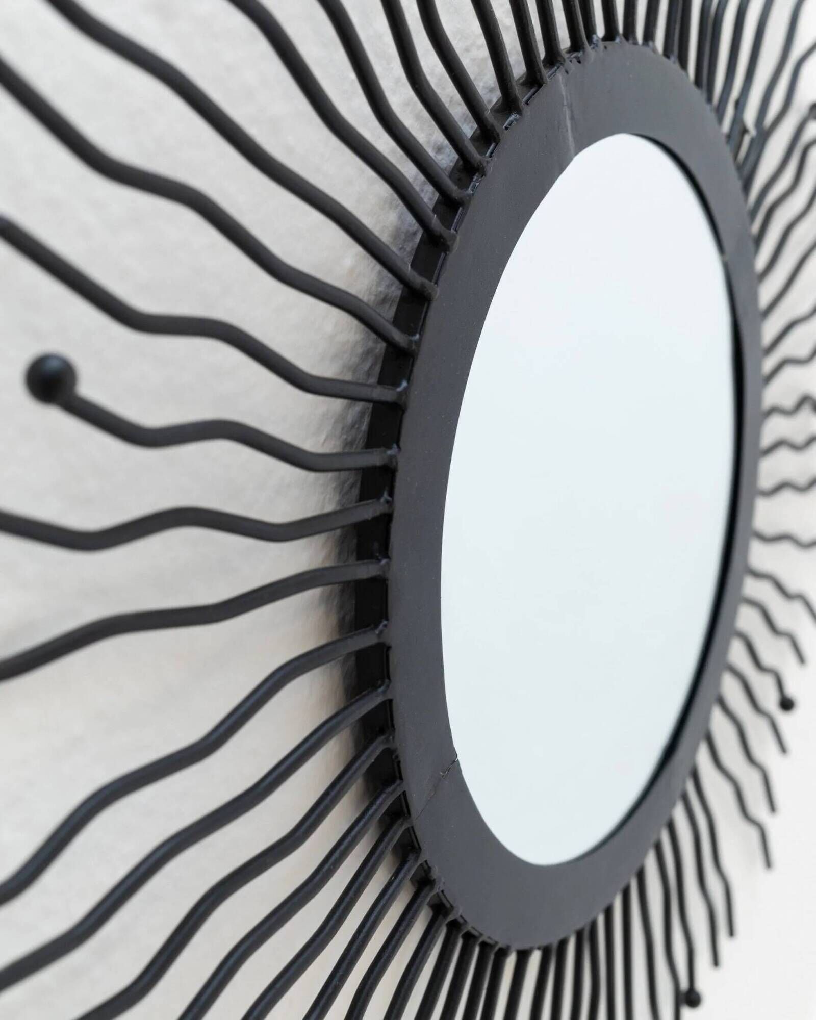 Black metal sunburst wall mirror, round 63x63 cm, vintage 1990s, made in Italy
