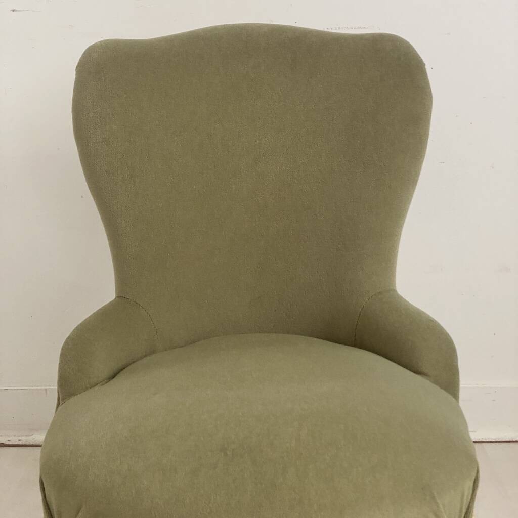 Small green velvet tub chair