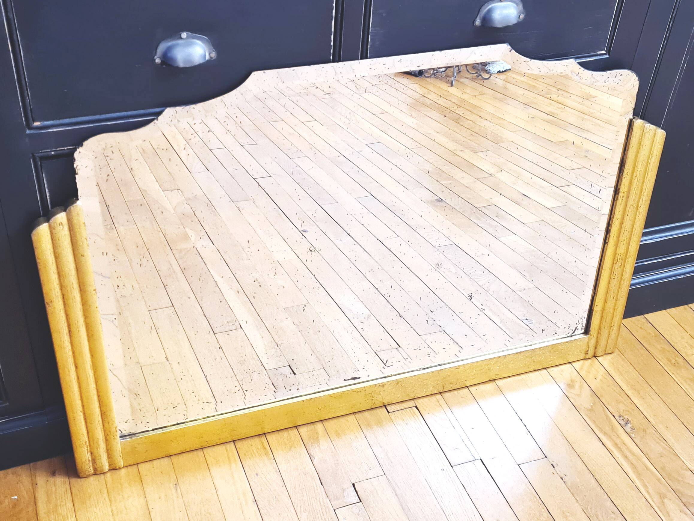 Antique large beveled mercury pediment mirror, art deco, gilded with leaf.