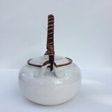Vintage teapot with wicker handle