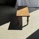 Brown Indonesian teak coffee table, with a border and cylindrical legs H40 L103.