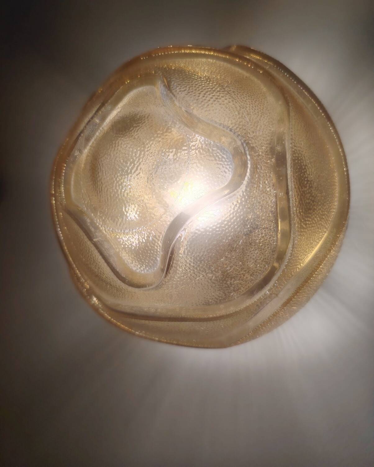 Textured amber globe wall light