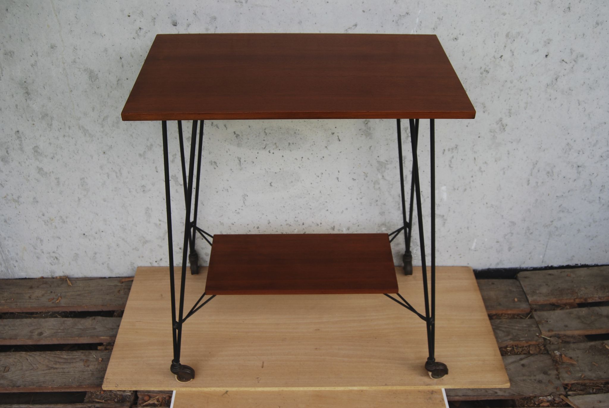 Tv furniture, a table with teak wheels and Scandinavian-style metal.