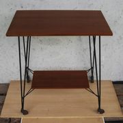 Tv furniture, a table with teak wheels and Scandinavian-style metal.