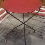 Old tripod table with folding chairs