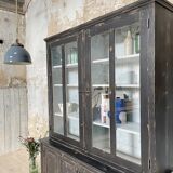 Display cabinet in patinated wood