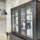 Display cabinet in patinated wood