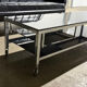 Table basse design vintage chrome et verre fumé noir sur roulettes