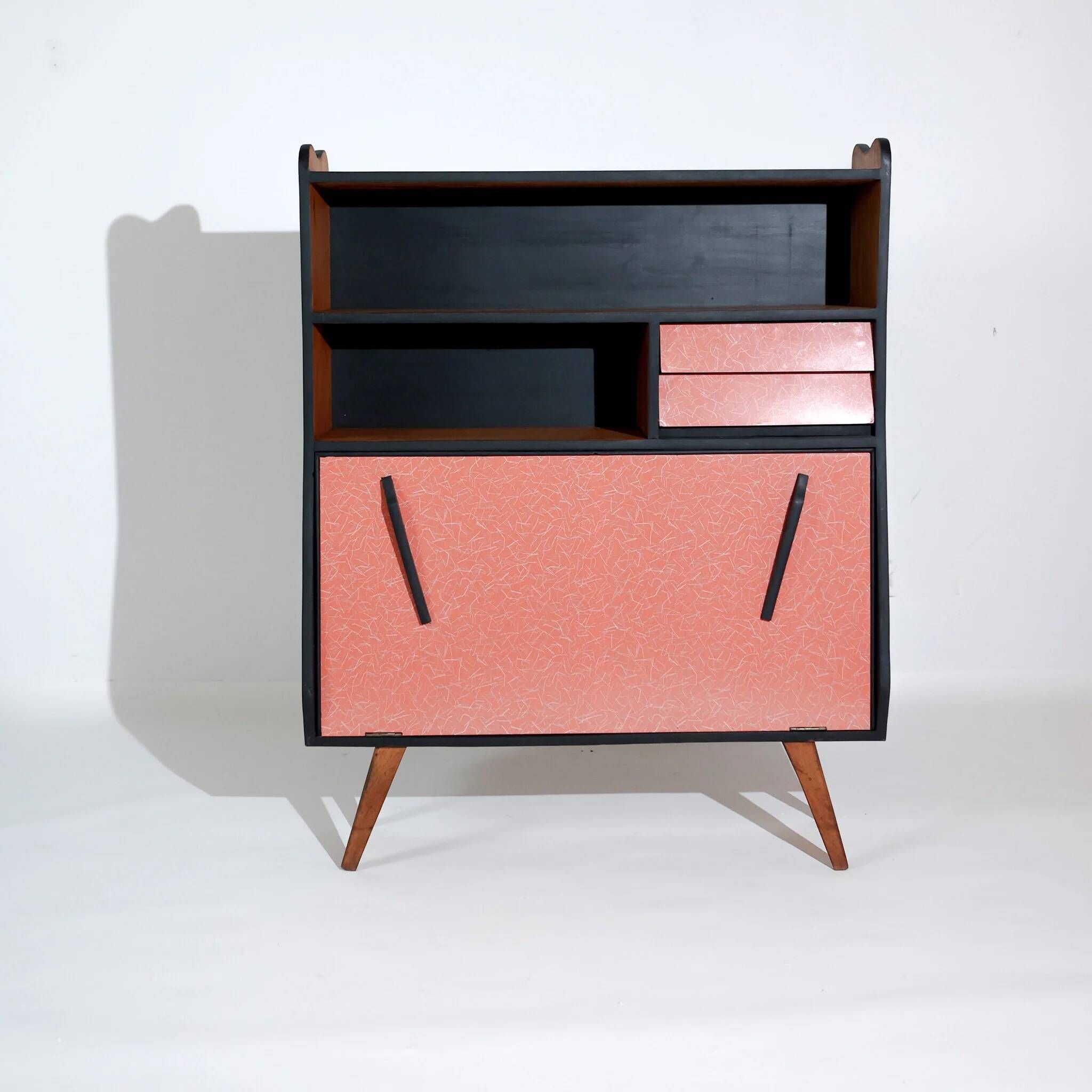 Vintage retro wooden storage furniture with salmon-coral accents and tapered legs, 1950s.