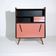Vintage retro wooden storage furniture with salmon-coral accents and tapered legs, 1950s.