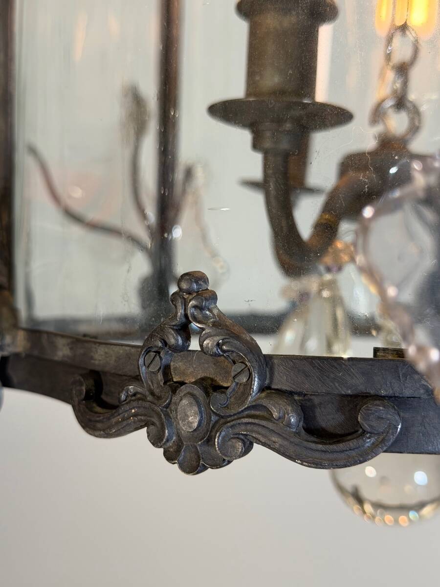 Louis XV style lantern in blackened brass adorned with cut crystal pendants, circa 1900.