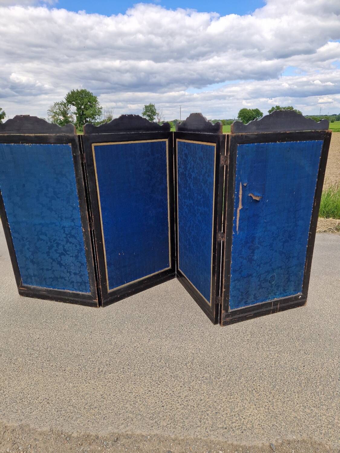 Folding screen in black-painted wood, 19th century