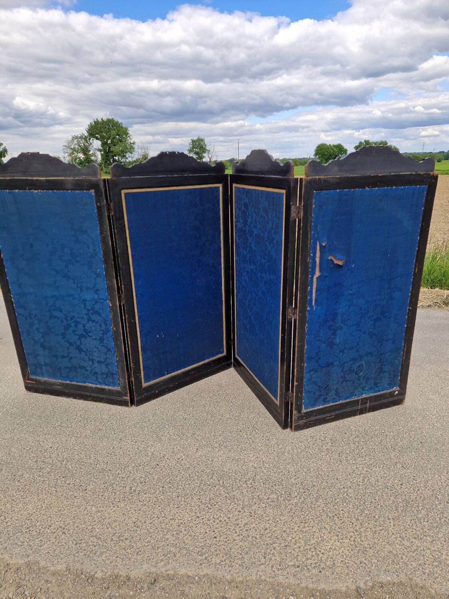 Folding screen in black-painted wood, 19th century