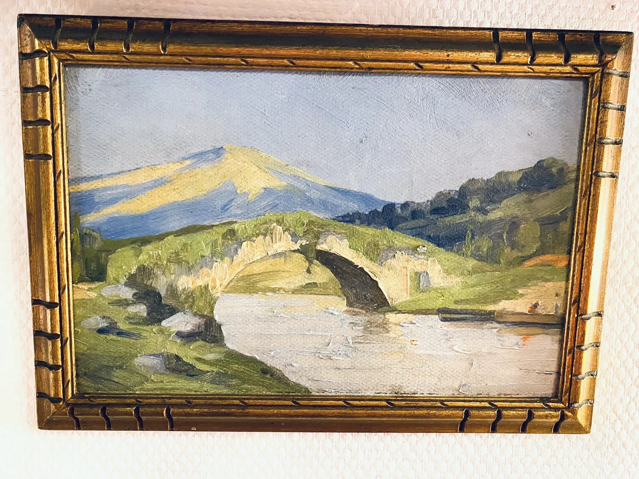 Small oil on panel of a countryside view from the early 20th century.