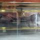 Vintage display coffee table in gilded brass and glass with a lock.