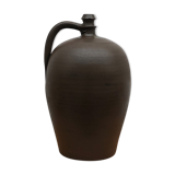 Ancient varnished sandstone jug