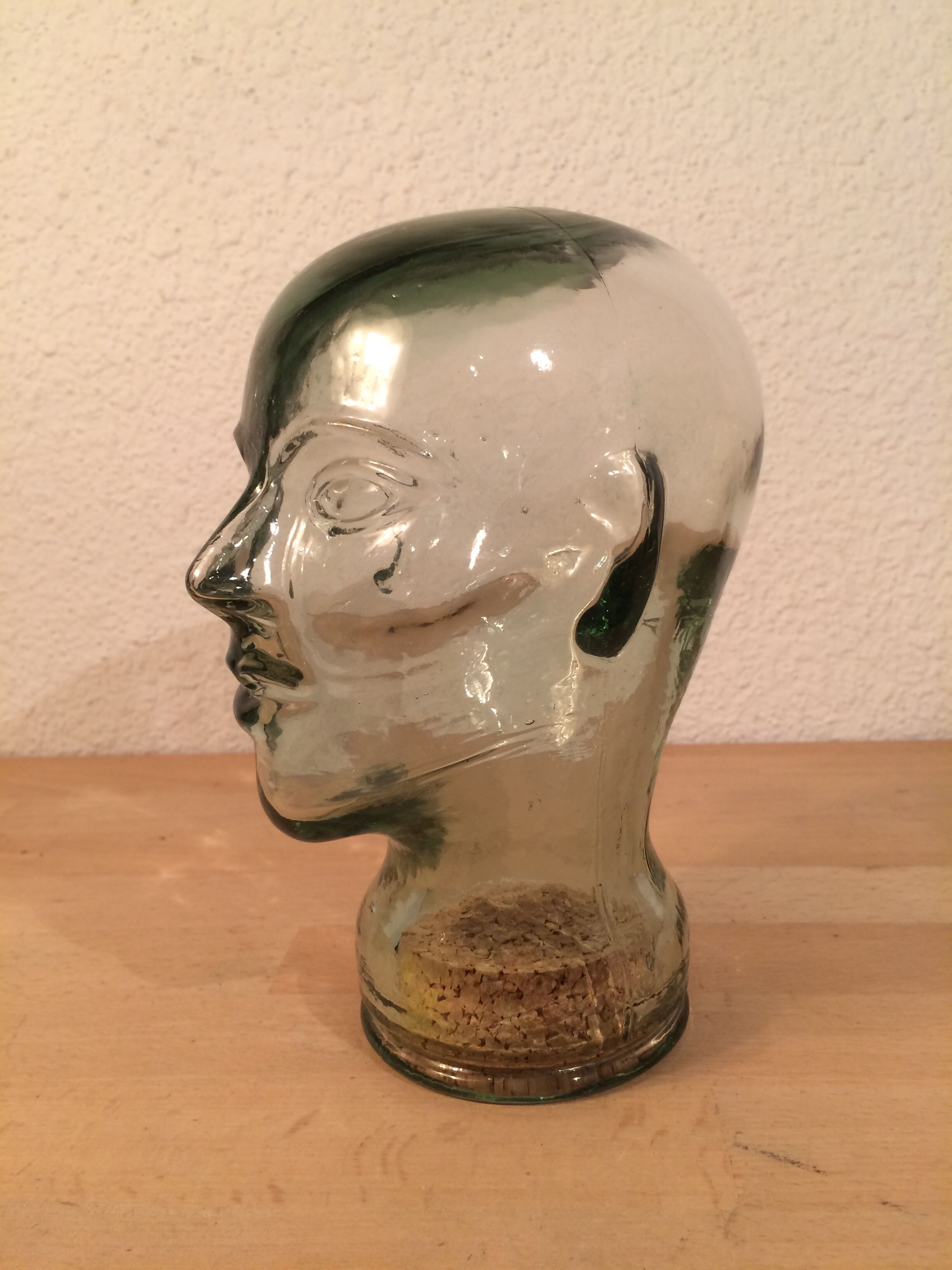 Molded glass head curiosity cabinet