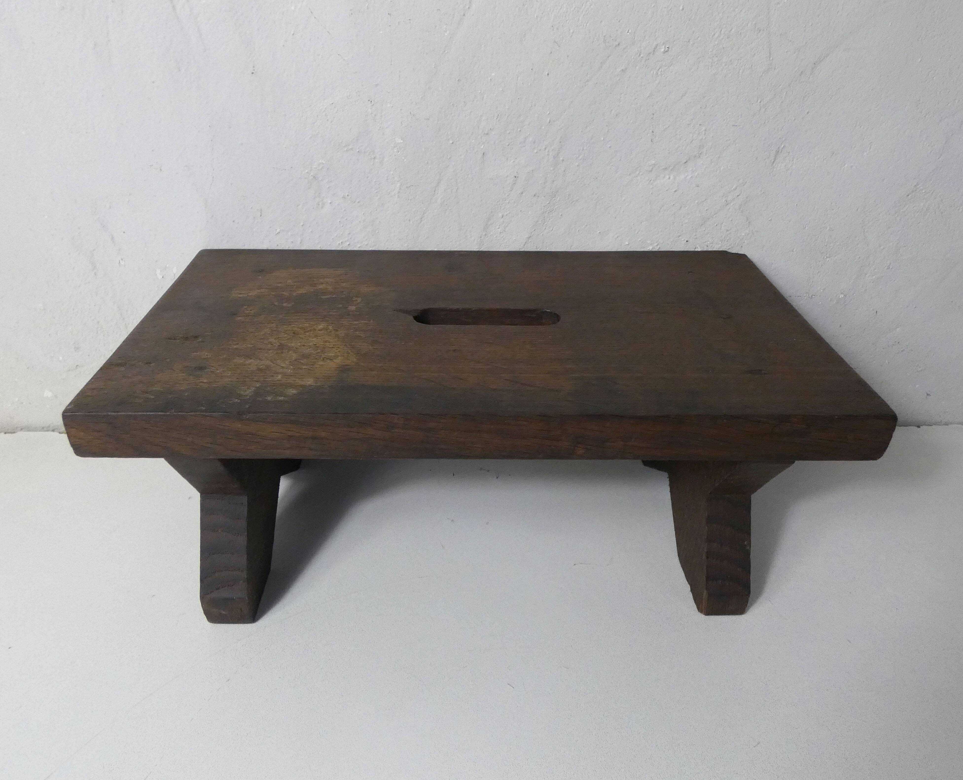 Old small wooden bench step in solid oak