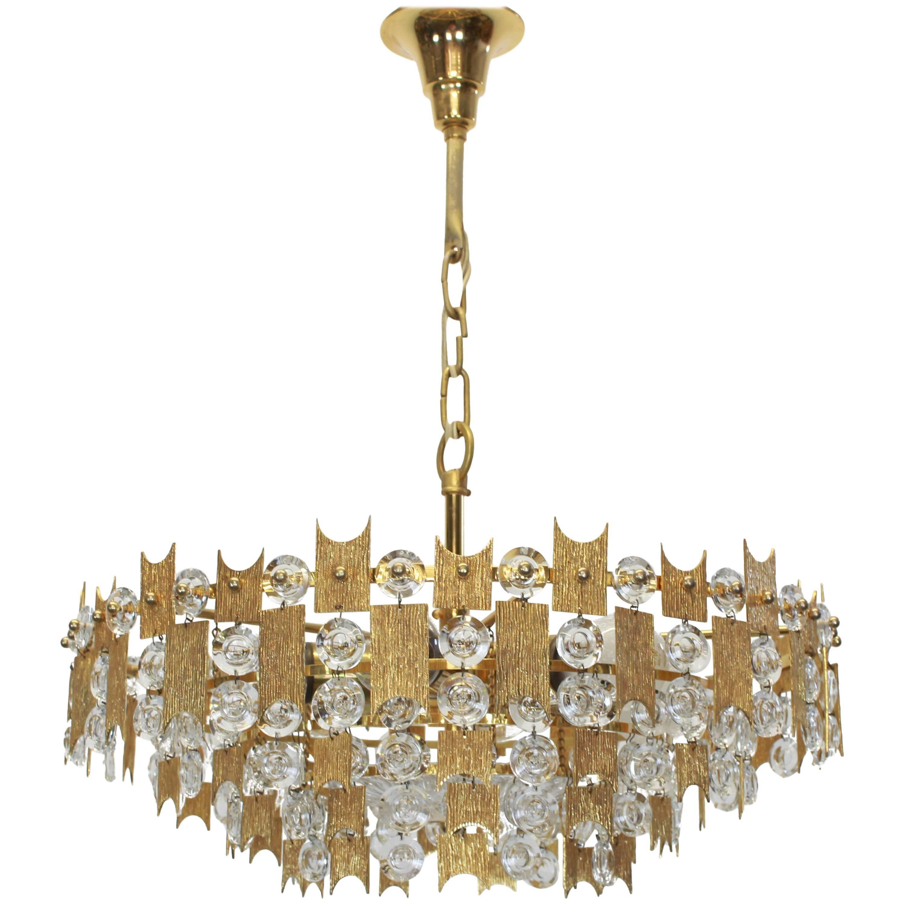 Impressive large chandelier in gilded brass and crystal glass by Palwa Germany, 1960s.